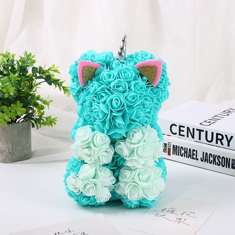 chat en roses bleu vert